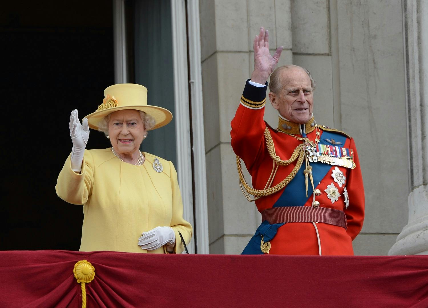 The Queen and the Duke of Edinburgh waving on the Buckingham Palace balcony