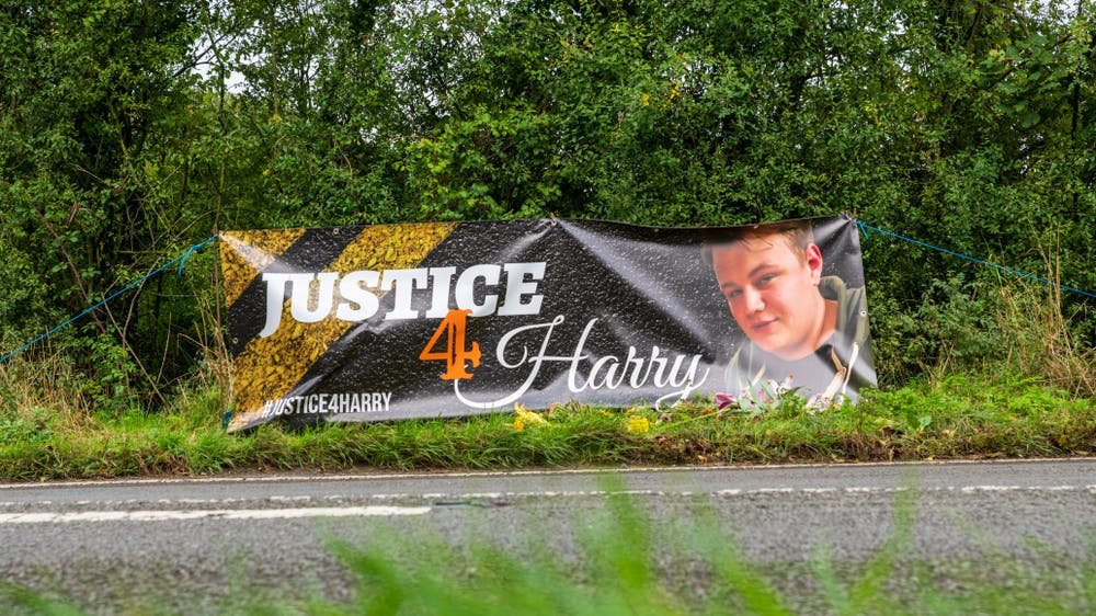 Justice 4 Harry banner on the side of the road