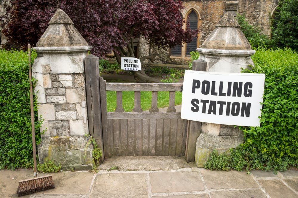Polling station sign at gates