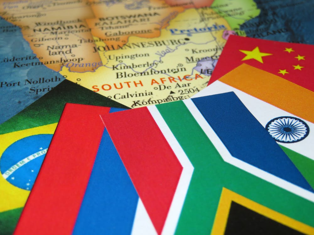 BRICS flags over map of South Africa
