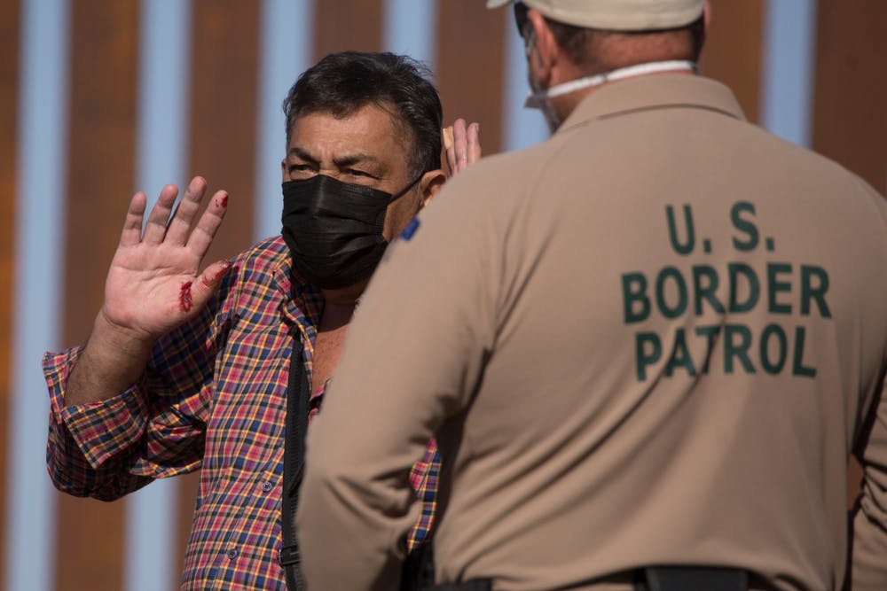 Border Patrol Agent speaks to migrant