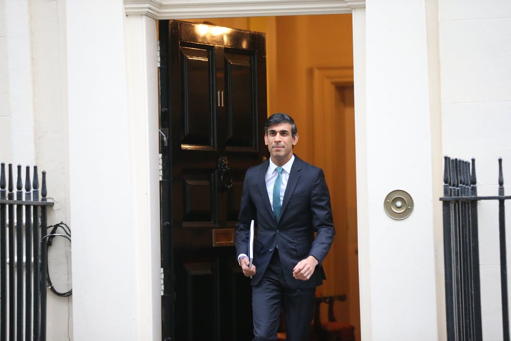 Rishi Sunak stands at the door of Downing Street