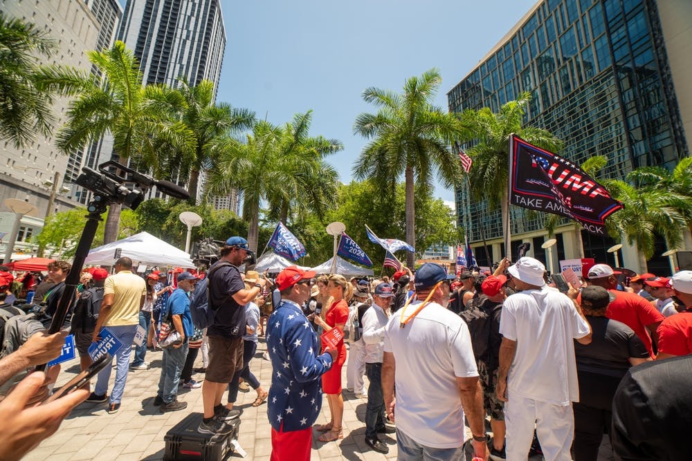 Trump supporters stand outside the federal courthouse in Miami