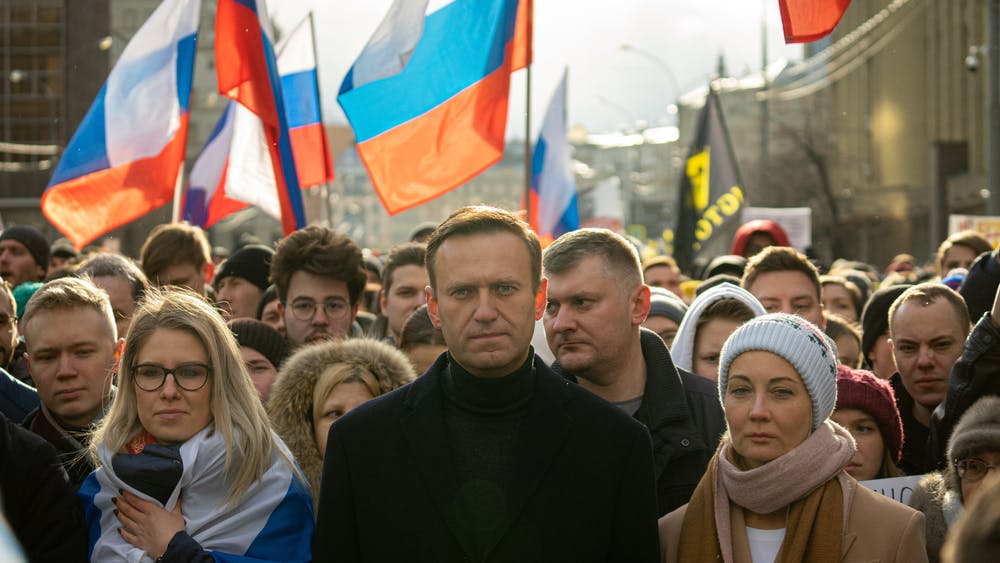 Alexei Navalny walks in a crowd
