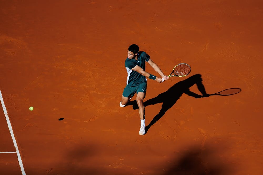 Carlos Alcaraz plays on a clay court