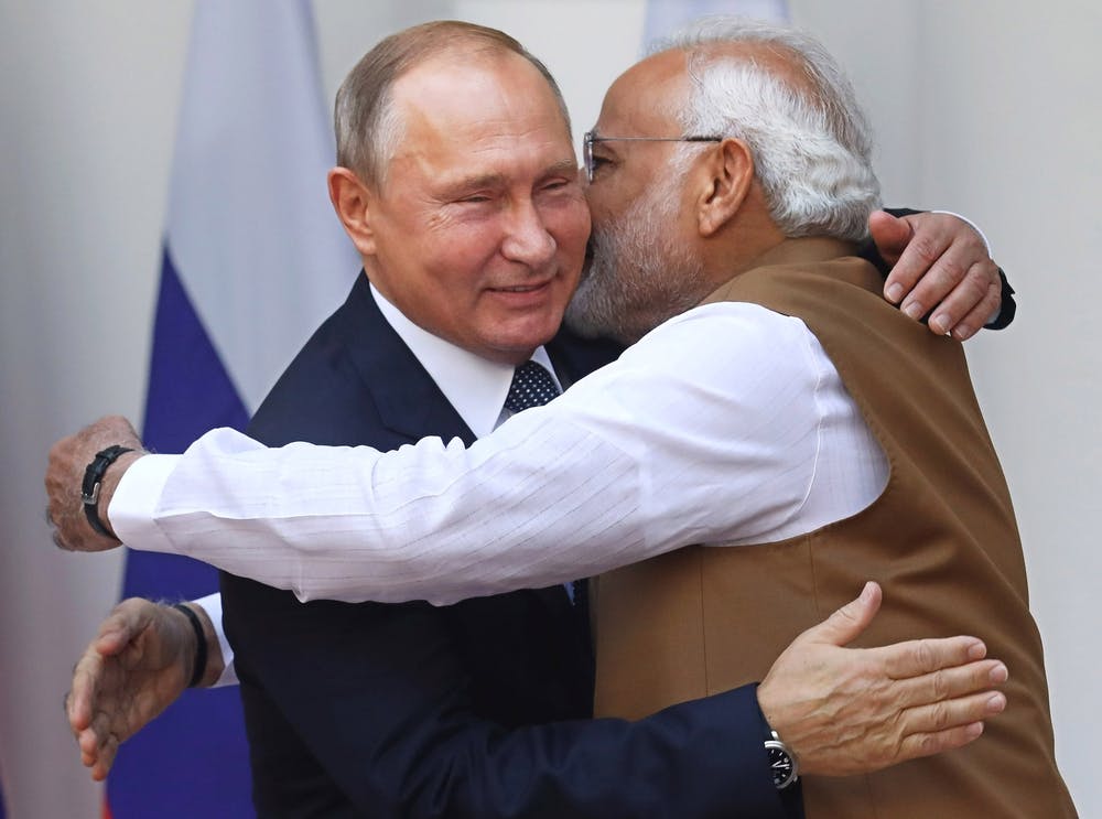 Vladimir Putin embraces Narendra Modi
