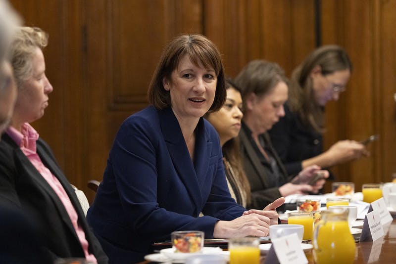 Rachel Reeves sits at a table with representatives from banks