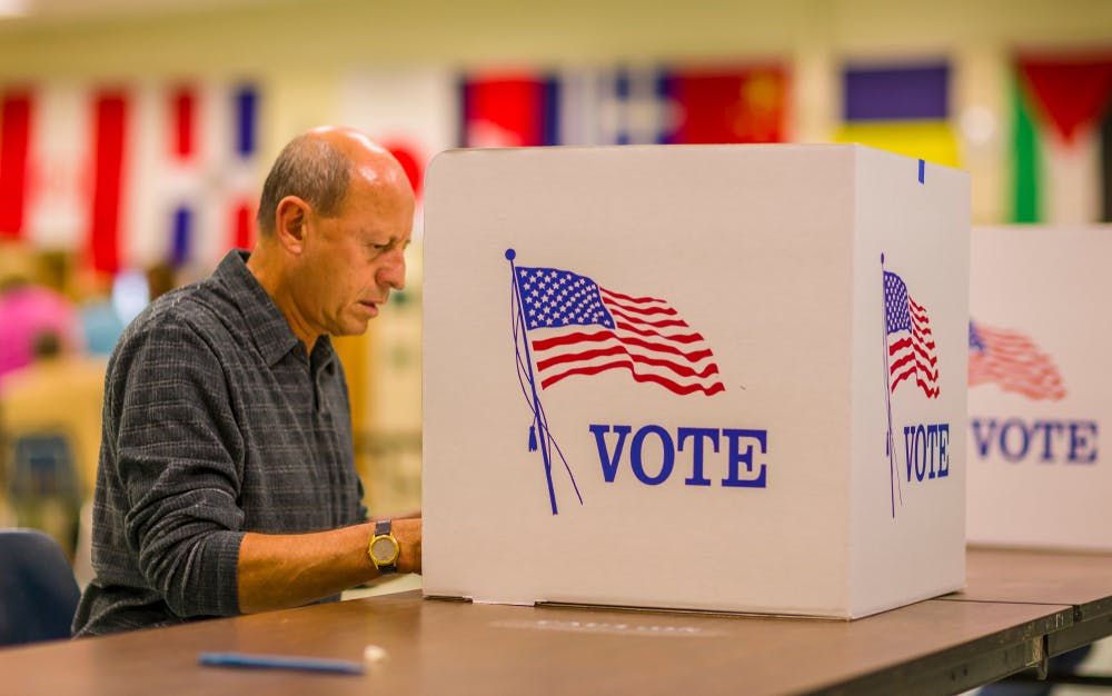 A man casts his vote at a polling station in Virginia
