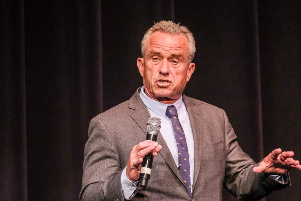 Robert F Kennedy Jr speaks into a microphone