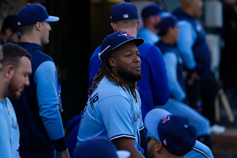 Vladimir Guerrero Jr sits in the Blue Jays dugout