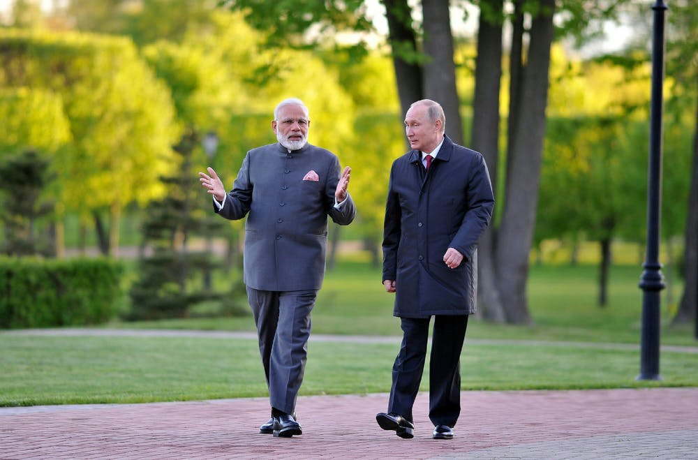Narendra Modi and Vladimir Putin walking together